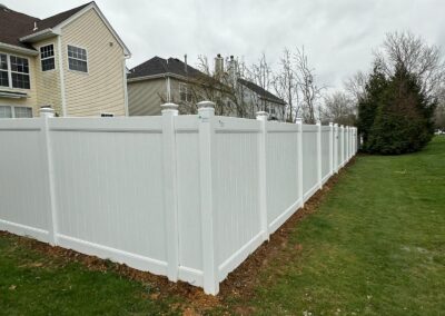 Vinyl fence by Fence Imperial, showcasing a sleek and modern design with low-maintenance features for a contemporary look.