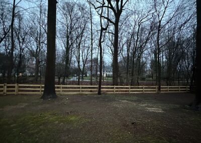 Classic wood fence installed by Fence Imperial, demonstrating elegant craftsmanship and natural beauty for enhancing property aesthetics.