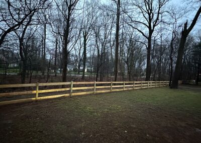 Classic wood fence installed by Fence Imperial, demonstrating elegant craftsmanship and natural beauty for enhancing property aesthetics.