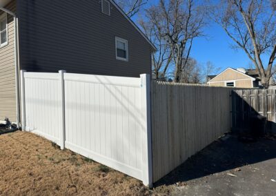 Classic wood fence installed by Fence Imperial, demonstrating elegant craftsmanship and natural beauty for enhancing property aesthetics.