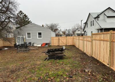 Classic wood fence installed by Fence Imperial, demonstrating elegant craftsmanship and natural beauty for enhancing property aesthetics.