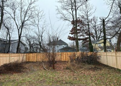 Classic wood fence installed by Fence Imperial, demonstrating elegant craftsmanship and natural beauty for enhancing property aesthetics.